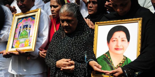 Indian Muslims hold a portrait of Tamil Nadu Chief Minister Jayalalitha Jayaram as they pray for her wellbeing as they stand in front of a hospital where she was being treated in Chennai on October 5, 2016.Jayalalithaa was hospitalised after complaining of fever and dehydration. / AFP / ARUN SANKAR (Photo credit should read ARUN SANKAR/AFP/Getty Images)