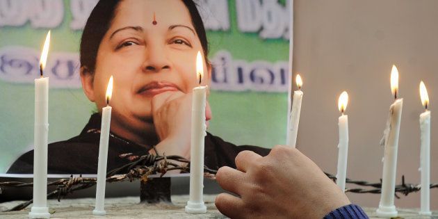 Indian supporters of Indian politician and actress Jayalalithaa Jayaraman, light candles as they pay tribute after her death, in Allahabad on December 6, 2016.