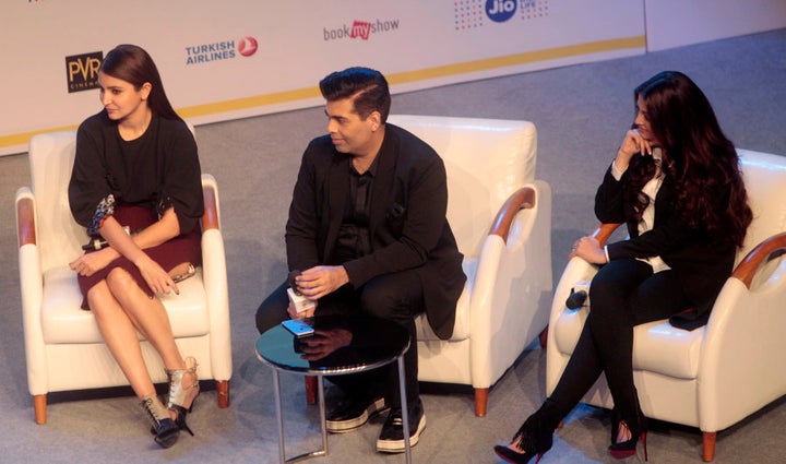 Anushka Sharma, Karan Johar, center, and actress Aishwarya Rai participate in a talk show during MAMI 18th Mumbai Film Festival in Mumbai.