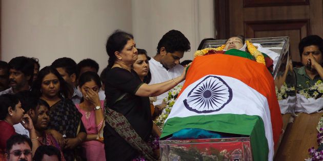 Sasikala Natarajan next to Chief Minister J Jayalalithaa's body in Chennai, on 6 December 2016. (AP Photo/Aijaz Rahi)