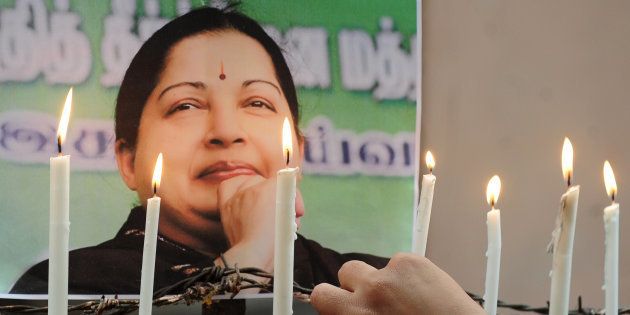 Indian supporters of Indian politician and actress Jayalalithaa Jayaraman, light candles as they pay tribute after her death, in Allahabad on December 6, 2016. Grief-stricken fans on December 6 mourned the death of one of India's most popular politicians, Jayalalithaa Jayaram, as fears of unrest loomed in her state where she enjoyed almost god-like status. / AFP / SANJAY KANOJIA (Photo credit should read SANJAY KANOJIA/AFP/Getty Images)