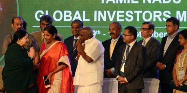 The Chief Minister of the southern Indian state of Tamil Nadu Jayalalithaa Jayaram (L) gestures towards delegates onstage during the Global Investors Meet 2015 at the Chennai Trade Centre in the Indian city of Chennai on September 9, 2015. The southern state of Tamil Nadu is expecting investment from foreign investors to encourage industrial development. AFP PHOTO / STR (Photo credit should read STRDEL/AFP/Getty Images)