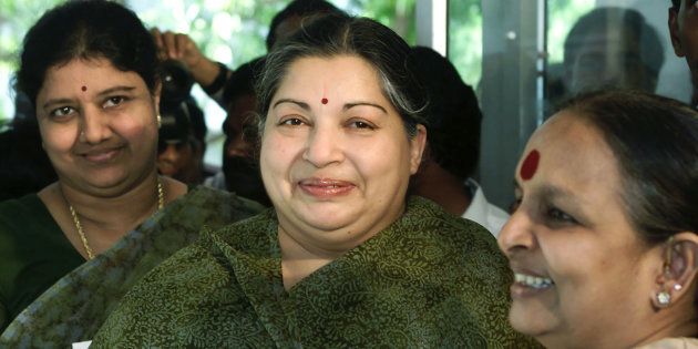 Former filmstar and powerful regional politician Jayaram Jayalalitha (C), leader of the opposition AIADMK party alliance, arrives with her companion Sasikala Natarajan (L) and an unidentified woman at a polling booth in Madras, May 10, 2001. Though polling for the state assembly was largely peaceful in the southern Indian state of Tamil Nadu, violence plagued elections in India's insurgency-hit state of Assam. SK/PB