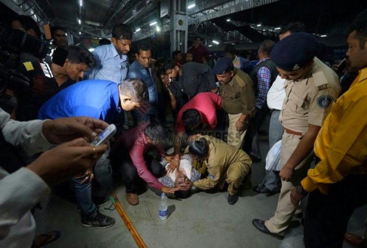 Police personnel trying to assist Farid Khan, who was declared dead on arrival at a private hospital.