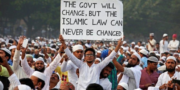 A man holds a banner during a rally organised by All India Muslim Personal Law Board (AIMPLB) in support of the Muslim Personal Law against what they say is central government's move to change it and impose the Uniform Civil Code across the country, in Kolkata, India, November 20, 2016. REUTERS/Rupak De Chowdhuri