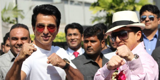 Jackie Chan and Sonu Sood strike fighting poses outside Mumbai airport.