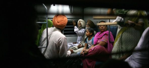 Indian cancer sufferer Mukthiar Singh boards a train in Bathinda.