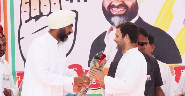 Congress Vice President Rahul Gandhi with PPP leader Manpreet Singh Badal during an election campaign rally in April 2014 in Bathinda.