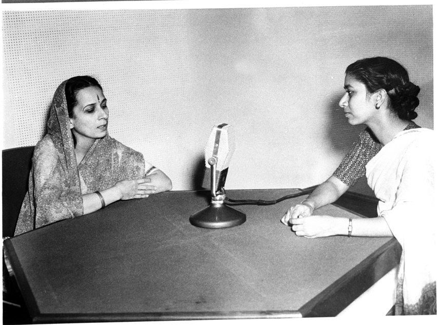 Photo Shows film star Vanmala being interviewed in a radio broadcast by AIR, February, 1956.