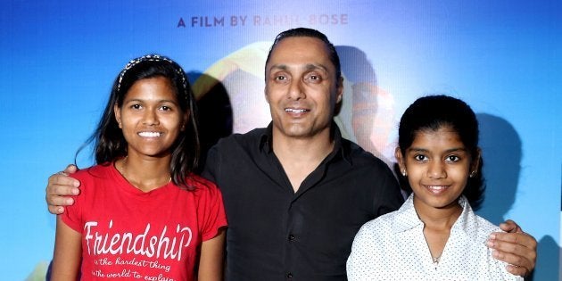 Indian mountaineer Poorna Malavath (L) and actress Aditi Inamdar (R) attend the screening of upcoming Hindi film 'Poorna' directed by Rahul Bose (C).