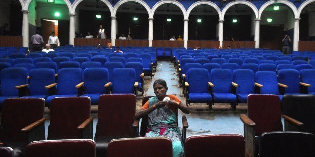 This picture taken on March 27, 2017 shows spectators waiting for a film showing at the Regal cinema, an 84-year-old movie hall, in the heart of New Delhi.