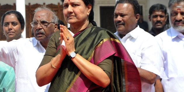 General secretary of southern Tamil Nadu state's ruling All India Anna Dravida Munnetra Kazhagam (AIADMK), VK Sasikala (C) gestures to cadres on her arrival to take up office at the AIADMK headquarters in Chennai on December 31, 2016.