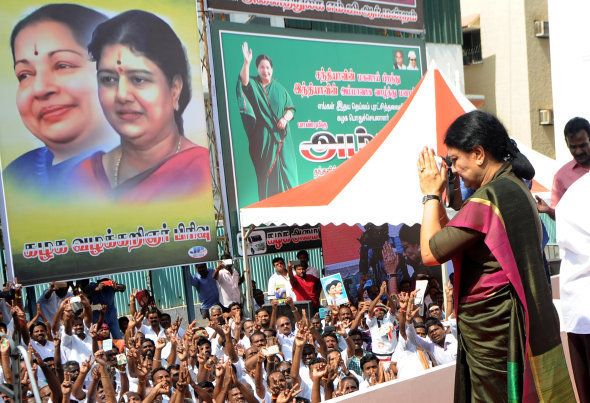 General secretary of southern Tamil Nadu state's ruling All India Anna Dravida Munnetra Kazhagam (AIADMK), VK Sasikala gestures to cadres on her arrival to take up office at the AIADMK headquarters in Chennai on December 31, 2016. VK Sasikala was elected as the general secretary of southern Tamil Nadu state's ruling All India Anna Dravida Munnetra Kazhagam (AIADMK) after its chief, Jayalalithaa -- popularly known as 'Amma' or mother -- died aged 68 on December 5. / AFP / ARUN SANKAR (Photo credit should read ARUN SANKAR/AFP/Getty Images)