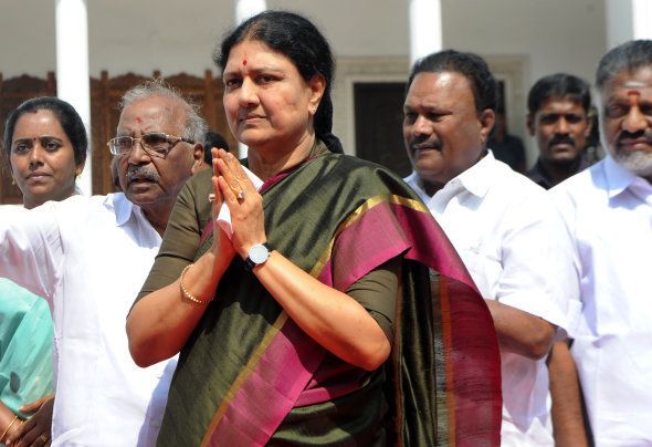 General secretary of southern Tamil Nadu state's ruling All India Anna Dravida Munnetra Kazhagam (AIADMK), VK Sasikala (C) gestures to cadres on her arrival to take up office at the AIADMK headquarters in Chennai on December 31, 2016.