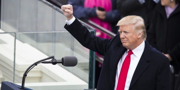 WASHINGTON, USA - JANUARY 20: President Donald Trump raises his fist to the crowds during the 58th U.S. Presidential Inauguration after he was sworn in as the 45th President of the United States of America in Washington, USA on January 20, 2017. (Photo by Samuel Corum/Anadolu Agency/Getty Images)