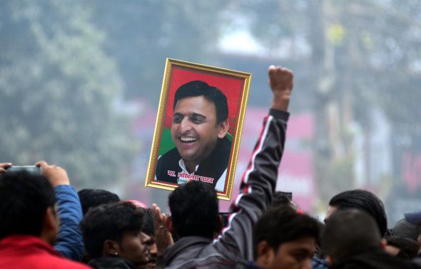 An Indian supporter of Uttar Pradesh's Chief Minister Akhilesh Yadav holds the photograph of Akhilesh Yadav as they protest againest the evictions of Akhilesh Yadav from Samajwadi Party for 6 years, in Allahabad on December 31,2016.Samajwadi Party national president Mulayam Singh yadav expelled Uttar Pradesh's Chiief Minister Akhilesh Yadav and general secretary Ramgopal Yadav from the Party for six years over alleged indiscipline , on friday. A day after Akhilesh Yadav was expelled from the samajwadi party by his father and party chief Mulayam singh yadav, has been taken back in the party. The decision was announced after the Uttar Pradesh Chief Minister met Mulayam singh . Akhilesh Yadav's close aide Ram Gopal yadav , who was also expelled yesterday, has been taken back as well. (Photo by Ritesh Shukla/NurPhoto via Getty Images)