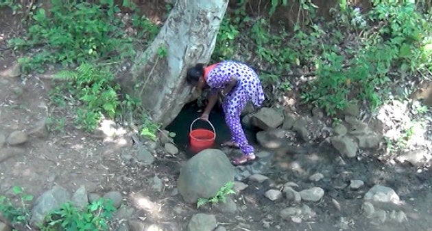 A dirty ditch is the only source of water in Kulappadi village