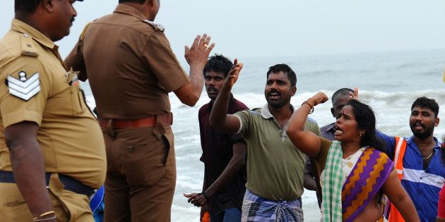 Indian police try to control a protest against the ban on the Jallikattu bull taming ritual at Marina Beach in Chennai on January 23, 2017.