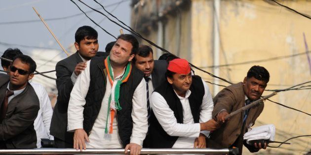 Uttar Pradesh chief minister and Samajwadi Party president Akhilesh Yadav and Congress vice president Rahul Gandhi saving themselves from electric wire during a road show on January 29, 2017 in Lucknow, India.