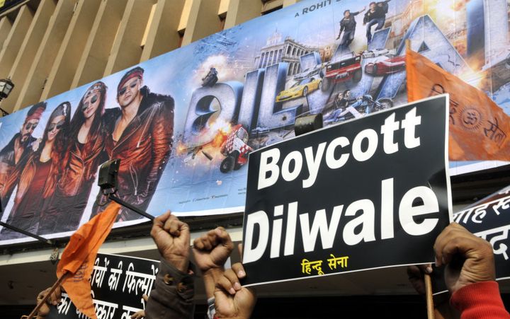 NEW DELHI, INDIA - DECEMBER 18: Activists of Hindu Sena hold a protest against the screening of the Shah Rukh Khan starrer Dilwale at Barakhamba Road on December 18, 2015 in New Delhi, India. Shah Rukh had earlier said that religious intolerance and not being secular is the worst kind of crime that you can do as a patriot. (Photo by Sonu Mehta/Hindustan Times via Getty Images)
