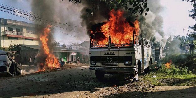 Vehicles are seen burning after being set alight by protesters in Imphal, the capital of Indias northeastern state of Manipur, on December 18, 2016.