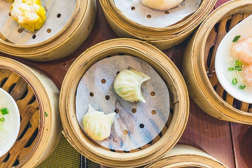 High Angle View Of Chinese Dumplings In Containers On Table