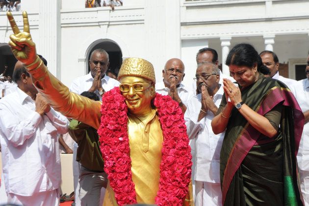 General secretary of southern Tamil Nadu state's ruling All India Anna Dravida Munnetra Kazhagam (AIADMK), VK Sasikala gestures to cadres after garlanding party founder M.G.Ramachandran's statue on her arrival to take up office at the AIADMK headquarters in Chennai on December 31, 2016. VK Sasikala was elected as the general secretary of southern Tamil Nadu state's ruling All India Anna Dravida Munnetra Kazhagam (AIADMK) after its chief, Jayalalithaa -- popularly known as 'Amma' or mother -- died aged 68 on December 5. / AFP / Arun SANKAR (Photo credit should read ARUN SANKAR/AFP/Getty Images)