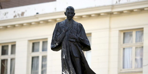 A statue of Mahatma Gandhi is seen after it was vandalized with white paint at Ghandi Square in Johannesburg April 13, 2015. REUTERS/Siphiwe Sibeko