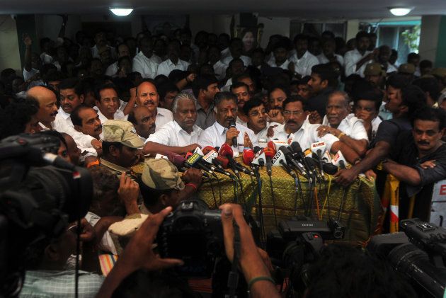 Acting chief minister O Panneerselvam (C) of the southern Indian state of Tamil Nadu speaks at a press conference at his home in Chennai on February 14, 2017.India's Supreme Court jailed the annointed next leader of Tamil Nadu for four years for corruption on February 14, heightening the turmoil in a state still reeling from the death of its long-time matriarch. VK Sasikala was told to surrender immediately to prison authorities after judges overturned her acquittal in a long-running 'disproportionate assets' case that also involved her late mentor Jayalalithaa Jayaram. Sasikala has been involved in a bitter battle in recent weeks with the state's acting chief minister O Panneerselvam who has been trying to block her ascent. / AFP / ARUN SANKAR (Photo credit should read ARUN SANKAR/AFP/Getty Images)