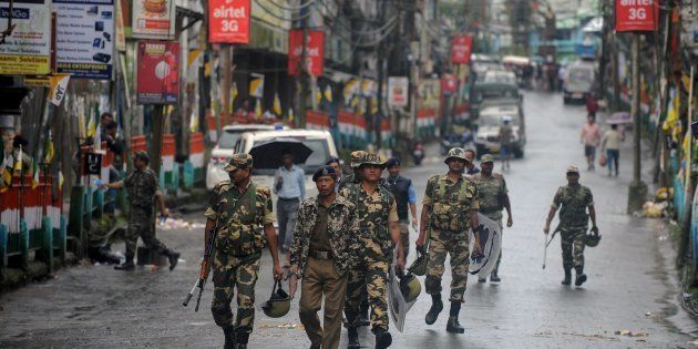 Indian paramilitary forces patrol during a strike demanding a new Indian state at Kalimpong town, some 75 km, from Siliguri, on September 28, 2016.