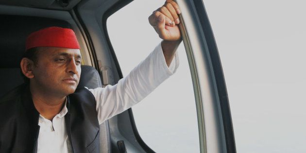 Uttar Pradesh state Chief Minister Akhilesh Yadav looks on inside a helicopter as he flies between between election campaign venues, in Uttar Pradesh.