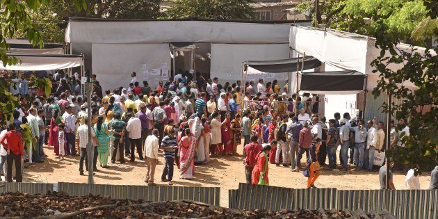 People at a polling booth at Jogeshwari on February 21, 2017 in Mumbai, India. Mumbai records 52.17% voter turnout, highest in last 3 elections. A total of 2,275 candidates are vying for the 227 councillor wards in the Brihanmumbai Municipal Corporation.