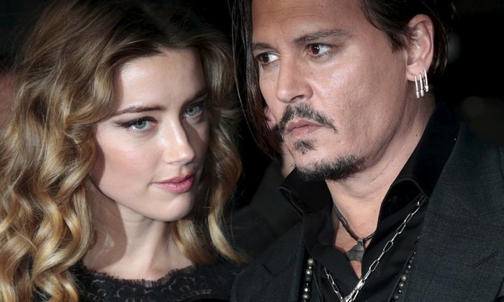 Johnny Depp and his actress wife Amber Heard arrive for the British premiere of the film "Black Mass" in London, Britain October 11, 2015. REUTERS/Suzanne Plunkett/File Photo