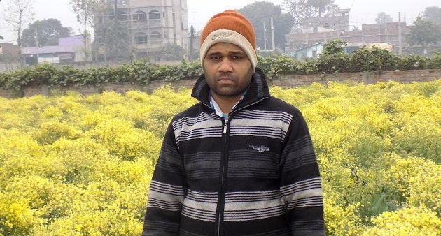Rakesh Kumar of Chakwara village in front of his cauliflower seed farm