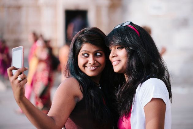 Two young women pose for a self portrait, Udaipur.