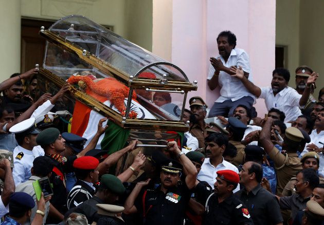 People cry as the body of Tamil Nadu Chief Minister Jayalalithaa Jayaraman is carried during her funeral procession in Chennai, India December 6, 2016. REUTERS/Adnan Abidi TPX IMAGES OF THE DAY