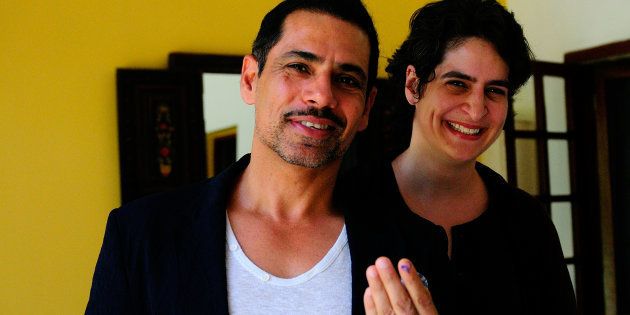 NEW DELHI, INDIA - APRIL 10: Robert Vadra with his wife Priyanka Gandhi showing vote marks on his finger after casting votes for general election of the 16th Lok Sabha 2014 on April 10, 2014 in New Delhi, India. (Photo by Priyanka Parashar/Mint via Getty Images)