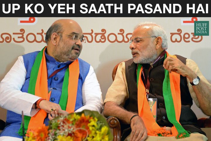 Indian Bharatiya Janata Party (BJP) national president Amit Shah (L) and Prime Minister Narendra Modi talk during a BJP office bearers' meeting held on the eve of the party's National Executive committee meeting in Bangalore on April 2, 2015. The two-day National Executive meeting, scheduled to begin on April 3, 2015 in Bangalore, will be the first such meeting since the BJP came to power last year. AFP PHOTO / Manjunath KIRAN (Photo credit should read MANJUNATH KIRAN/AFP/Getty Images)