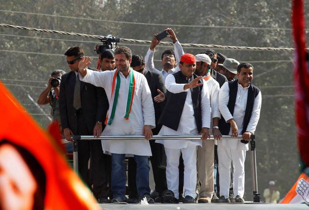 Rahul Gandhi (L), Vice-President of India's main opposition Congress Party, and Akhilesh Yadav, Samajwadi Party (SP) President and Chief Minister of the northern state of Uttar Pradesh, wave to the crowd during a road show ahead of the fourth phase of state assembly polls, in Allahabad, India, February 21, 2017. REUTERS/Jitendra Prakash