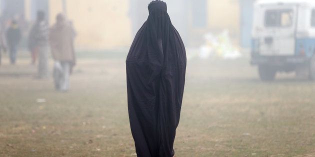 A woman wearing a burka leaves a polling booth after voting during the state assembly election, in the town of Deoband, in the state of Uttar Pradesh, India, February 15, 2017.
