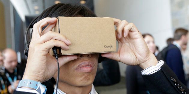 A man looks at Google Cardboard