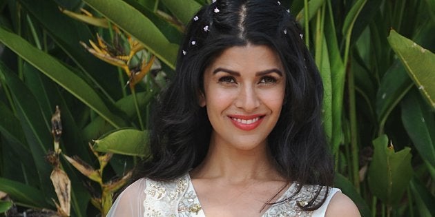 Indian Bollywood actress Nimrat Kaur poses for a photograph at Lakm�Fashion Week (LFW) Summer Resort 2018 in Mumbai on February 2, 2018. / AFP PHOTO / Sujit Jaiswal (Photo credit should read SUJIT JAISWAL/AFP/Getty Images)