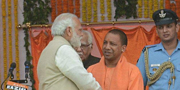 UP CM Yogi Adityanath and Prime Minister Narendra Modi with other party leaders during the swearing-in ceremony at Lucknow's sprawling Smriti Upvan complex, on March 19, 2017 in Lucknow, India.