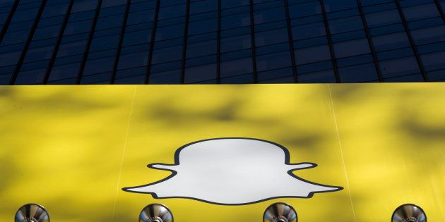 A billboard displays the logo of Snapchat above Times Square in New York March 12, 2015. REUTERS/Lucas Jackson (UNITED STATES - Tags: BUSINESS)