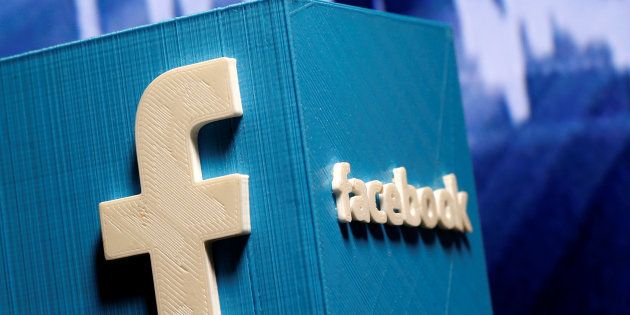 A 3D-printed Facebook logo is seen in front of a displayed stock graph in this illustration taken November 3, 2016. REUTERS/Dado Ruvic/Illustration
