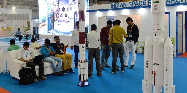Visitors look at the model of Satellite launch vehicle at the ISRO stall in Bangalore International Exhibition Centre during the inaugural day of the fifth edition of the three-day Bengaluru Space Expo 2016