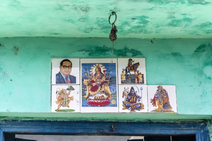 Images of Bhimrao Ramji Ambedkar known as Babasaheb, India's first minister of law and justice and a social reformer who inspired the Dalit Buddhist Movement, top left, and gods and godesses are displayed outside a house in in Sambhal, Uttar Pradesh, India, on Monday, Aug. 22, 2016. Prime Minister Narendra Modi's Hindu-nationalist Bharatiya Janata Party (BJP) is seeking to woo Dalits in order to win the state's legislative elections, which would give him greater momentum to push his economic agenda at the national level. While the BJP dominated Uttar Pradesh in the 2014 national elections, Modi faces a tough fight for Dalit votes against several caste-based parties -- in a state where caste is the most important factor for voters. Photographer: Prashanth Vishwanathan/Bloomberg via Getty Images