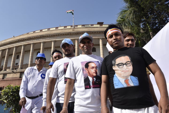 NEW DELHI, INDIA - APRIL 14: People pay tributes during the floral tribute ceremony of Dr. B.R. Ambedkar on his 125th birth anniversary at Parliament House, on April 14, 2016 in New Delhi, India. Born on April 14, 1891 to Bhimabai Sakpal and Ramji in Madhya Pradesh, Ambedkar was the Chief Architect of India's constitution. He died on December 6, 1956. (Photo by Arvind Yadav/Hindustan Times via Getty Images)