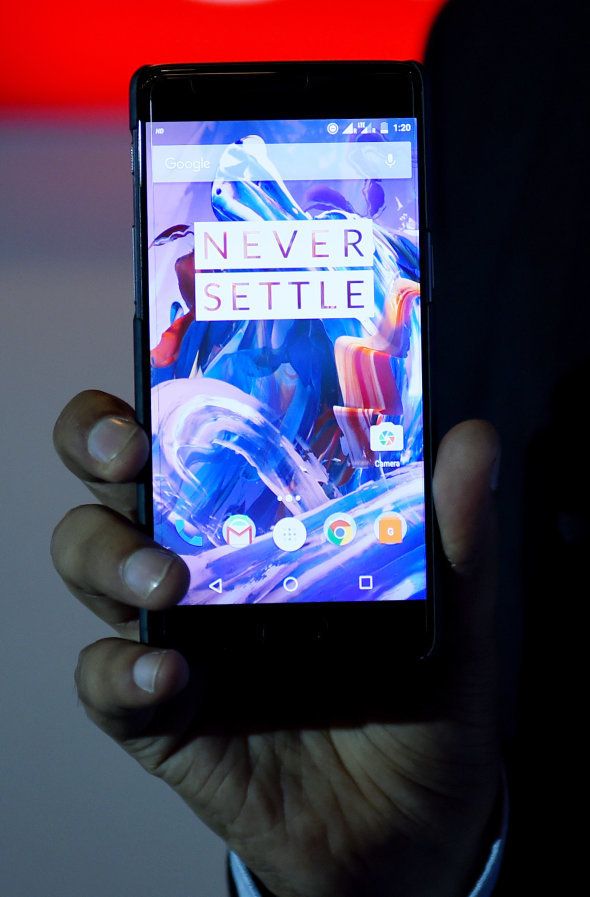 Vikas Agarwal, General Manager for Indian of the OnePlus cellphone company holds a newly-launched OnePlus 3