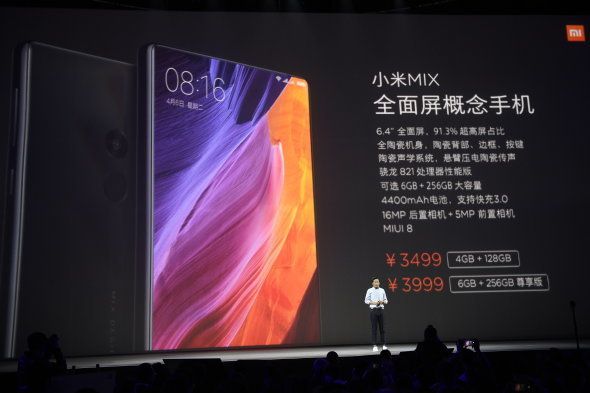 BEIJING, CHINA - OCTOBER 25: Lei Jun, Chairman and Chief Executive Officer of Xiaomi Inc., introduces Xiaomi VR glasses, new smartphones including Xiaomi Mi Note 2 and Xiaomi Mi Mix during a launch event